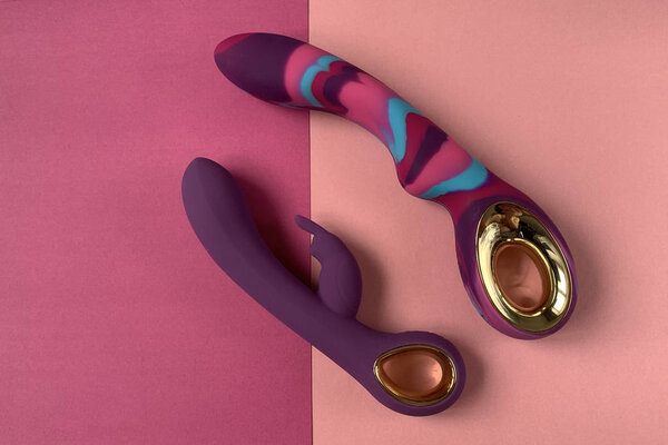 Vibrators. Sex toys with vibration on a pink background. Useful for adult, sex shop