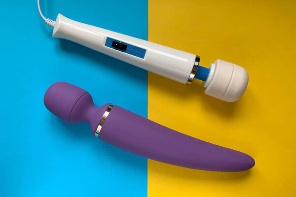 Sex toys. Massager vibrators on a blue/yellow background. Useful for sex shop, adult