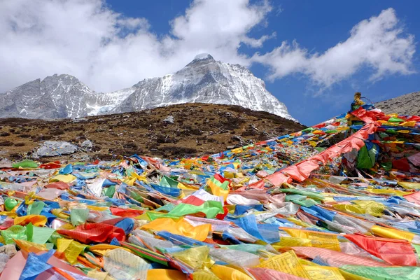 Tibetan Prayer flags along the way to the Milk lake at Yading Nature Reserve in China