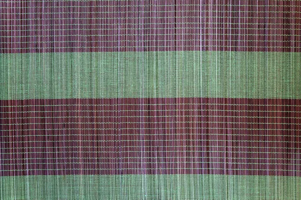 Hintergrund aus Bambusmatte Platte, buntes Muster, Bambusstruktur, Leerstelle aus Bambusmatte — Stockfoto