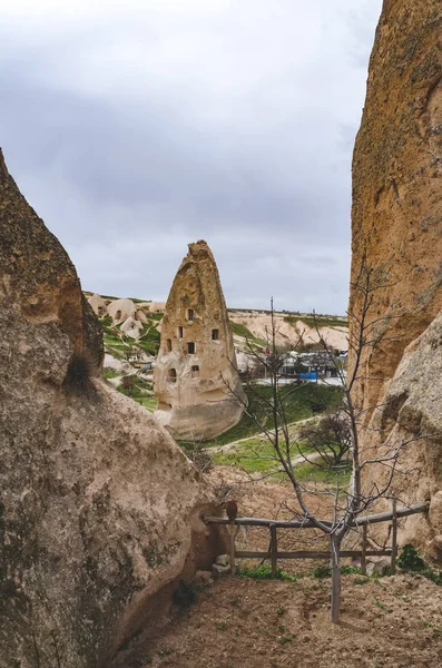 Dwellings in the rocks of volcanic tuff in Turkish Cappadocia. Goreme National Park. — Stock Photo, Image