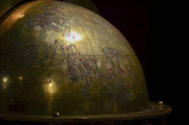 Istanbul, TURKEY, September 20, 2018. Fragment of an ancient bronze globe with the image of constellations and mythological characters. Museum of The History of Science and Technology