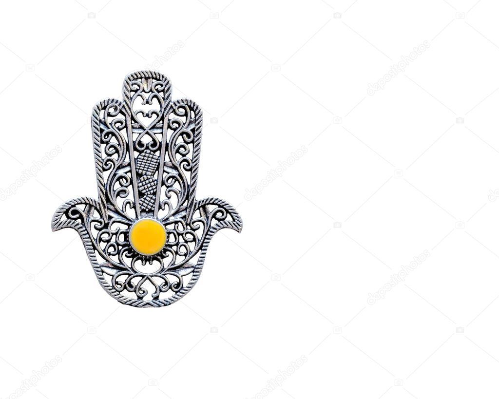 Fatima Hand closeup on a white background with a copyspace. Ancient symbol and traditional modern tourist souvenir of Tunisia