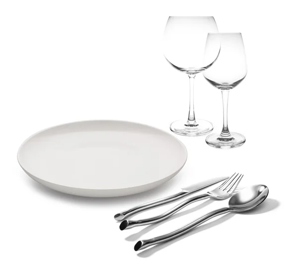 Tenedor y cuchillo en copas de vino aisladas — Foto de Stock