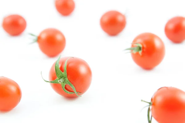 Organic red tomatoes on white — Stock Photo, Image