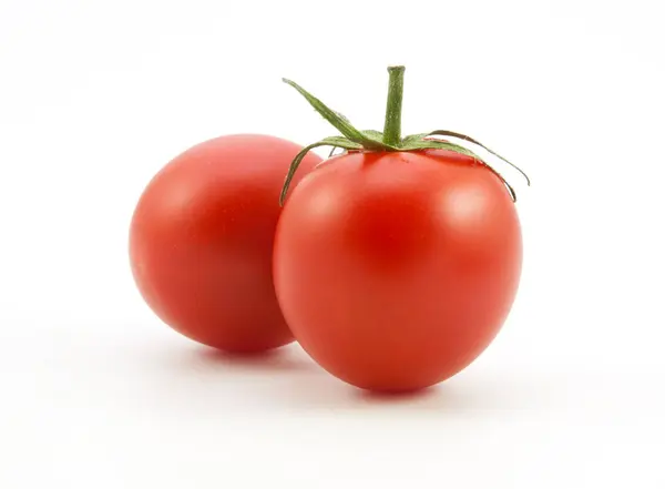 Органічні червоні помідори на білому — стокове фото