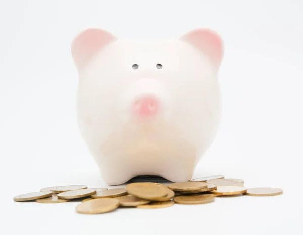 Piggy bank en munt — Stockfoto