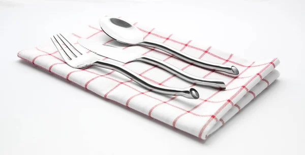 Bestick kniv gaffel och sked servett — Stockfoto