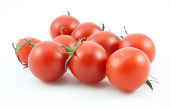 Organic red tomatoes on white — Stock Photo, Image