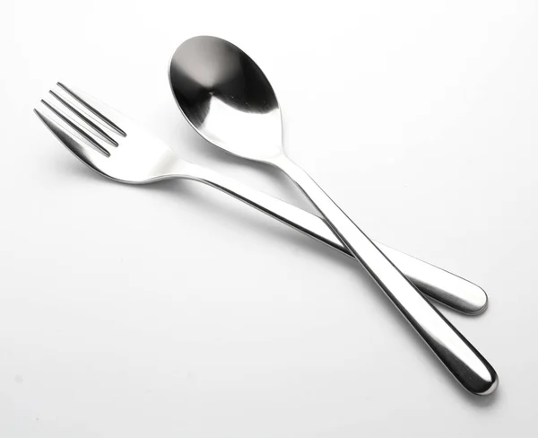 Forchetta e cucchiaio su bianco — Foto Stock