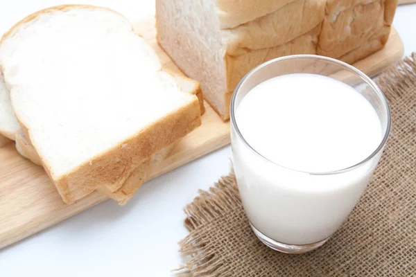 Glass of milk and sliced bread — Stock Photo, Image