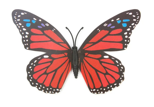 Красная фальшивая бабочка изолирована — стоковое фото