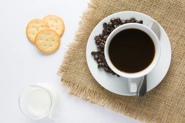 Cup of coffee and milk with biscuit on wooden table — Stock Photo, Image