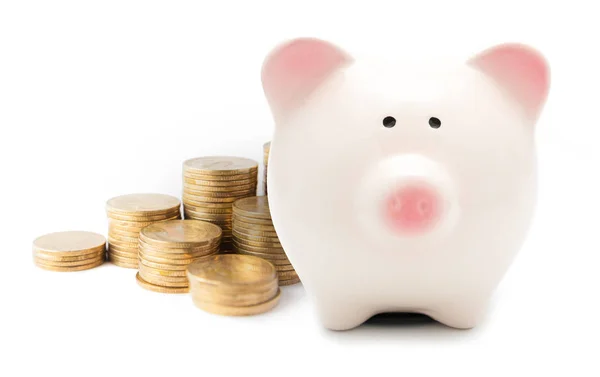 Piggy bank en munten geïsoleerd — Stockfoto