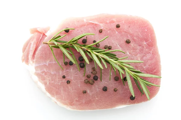 Pieces of raw pork steak with spices and herbs rosemary — Stock Photo, Image