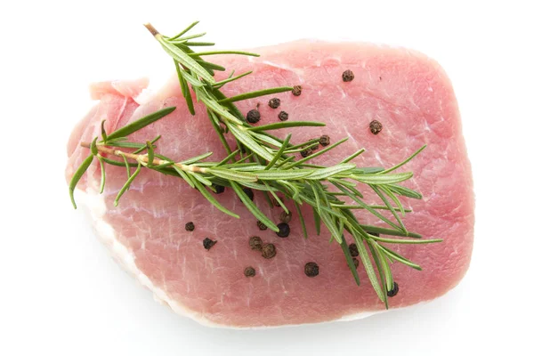 Pieces of raw pork steak with spices and herbs rosemary — Stock Photo, Image