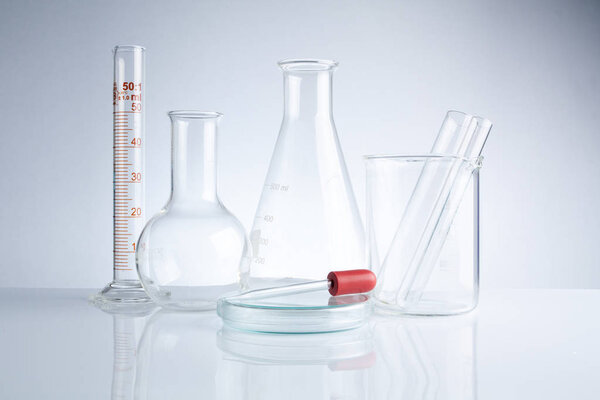 Laboratory glassware on table, Symbolic of science research.