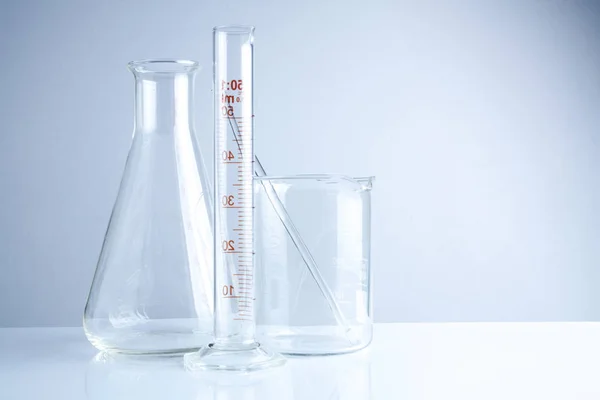 Laboratory glassware on table, Symbolic of science research. — Stock Photo, Image