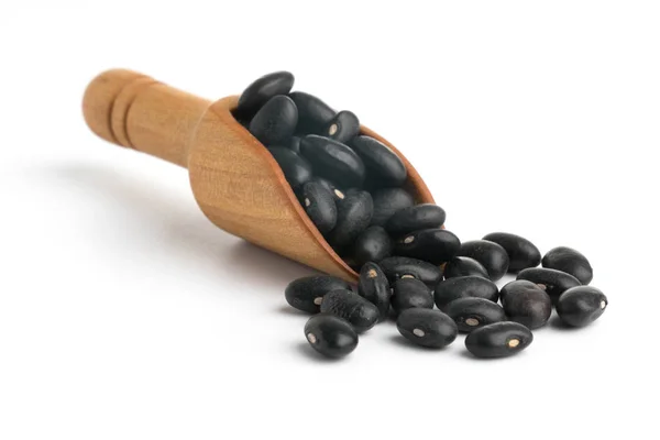 Black bean on spoon isolated top view — Stock Photo, Image