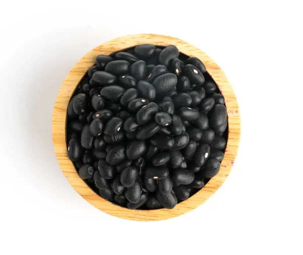 Black bean on spoon isolated top view — Stock Photo, Image
