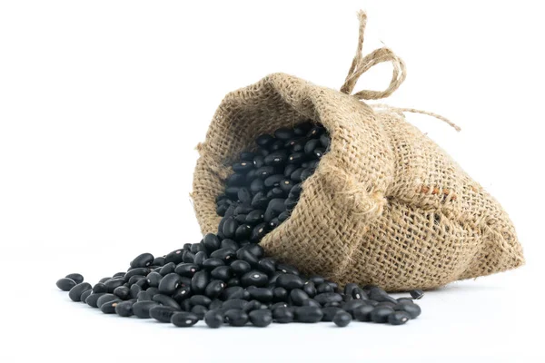 Black beans in canvas sack on white — Stock Photo, Image