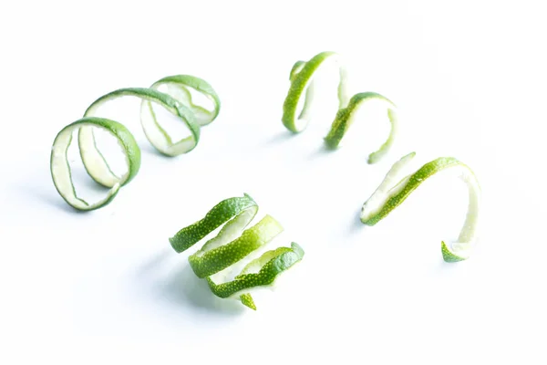 Green lemon twist on white — Stock Photo, Image