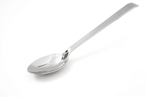 Cucchiaio d'argento isolato su bianco — Foto Stock