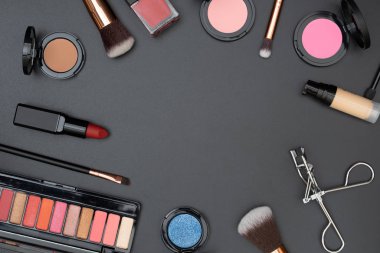 set decorative cosmetics with text space on black