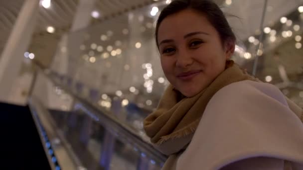 Attractive Young Mixed Woman Smiles on Escalator Closeup 4k — Stock Video