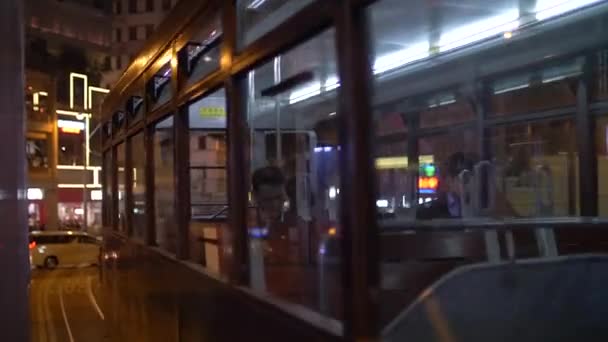 Hong Kong Tram Pass by at Nighttime Window Closeup 4k — Stock Video