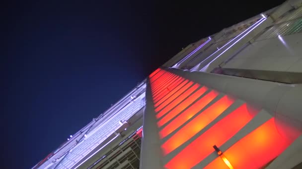 Spinning view of Illuminated skyscraper Nighttime 4k — 비디오