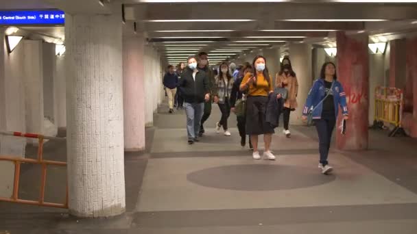 People Walk through crowded underground pathway 4k — Stock Video