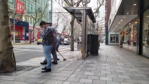 Street Cleaners are Washing the Bus Stop with Chemicals to Stop Corona Virus — Stock Video