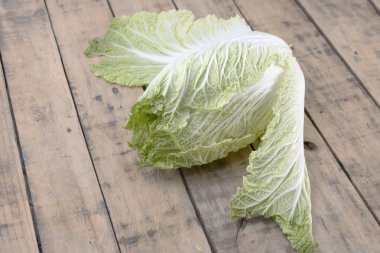 Chinese cabbage on wooden table. clipart