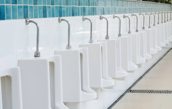 Row urinals in public toilet. — Stock Photo, Image