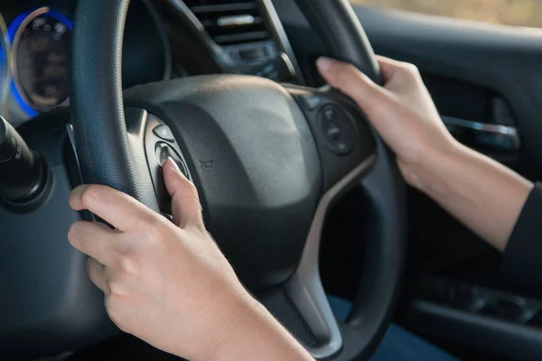 Business woman push a button in modern car. — Stock Photo, Image