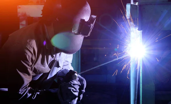 Industrial worker Welding and bright sparks. Hard job — Stock Photo, Image