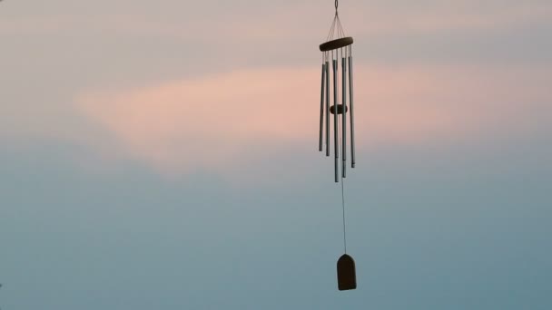 Wind chime tube mobile in breeze. — Stock Video