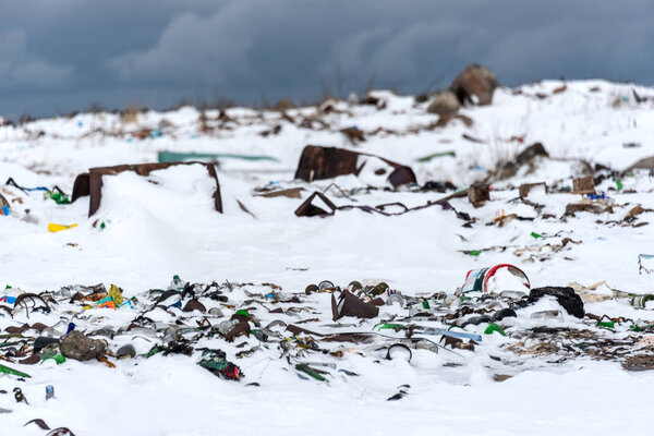 Illegal trash dump in the Arctic snow polluting the pristine environment