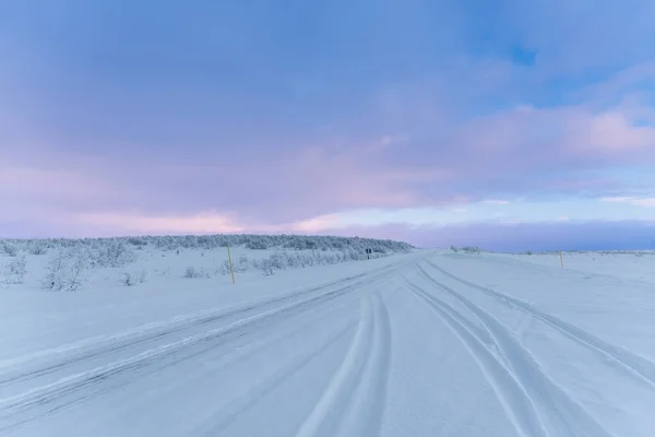 Tire Tracks Snow Covered Road Arctic Landscape Cloudy Evening Sky — 스톡 사진
