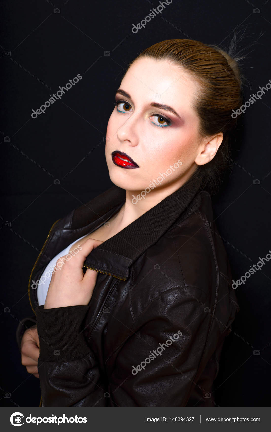 Blonde With Hair Gathered In A Bun And Professional Make Up With