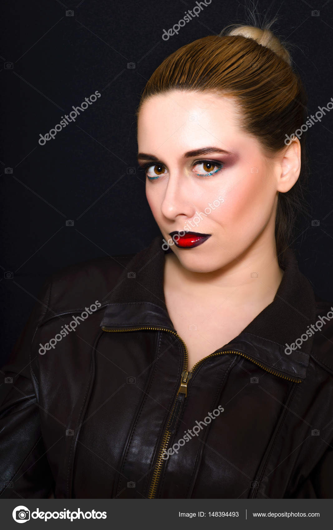 Blonde With Hair Gathered In A Bun And Professional Make Up With