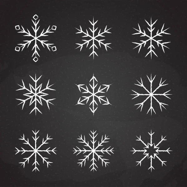 Set of icy snowflakes chalked sketch symbol — Stock Vector