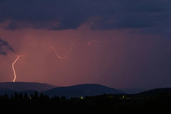 Thunderstorm with lightning on the mountain.
