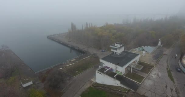 Aerial view of abandoned river station building on river bank, Central Europe — Stock Video