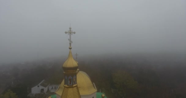 Aerial view Nikolaevsky Church of All Saints, city in dense fog, Ukraine — Stock Video