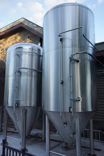 Stainless steel brewing and storage tanks at a brewery