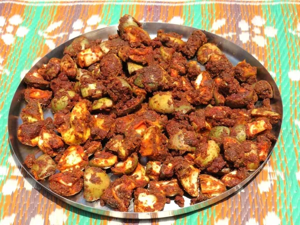 Mango Pickle in a dish. It is very popular pickle (Food) in India. Image taken at sunny day.