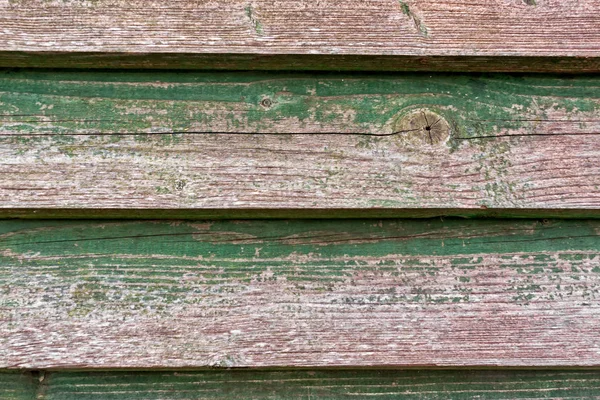 Тріснута фарба на дерев'яній стіні — стокове фото