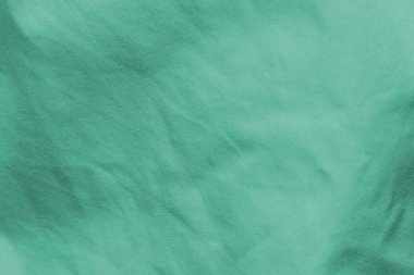 Cyan 'ın eşit olmayan yanmış kumaşı.